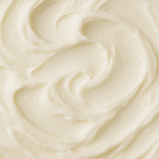 Whipped body butter being applied to skin as a rich facial moisturiser