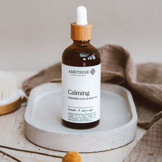Bottle of Ametrine Calming Face and Body Oil containing rosehip oil, jojoba and ceramides